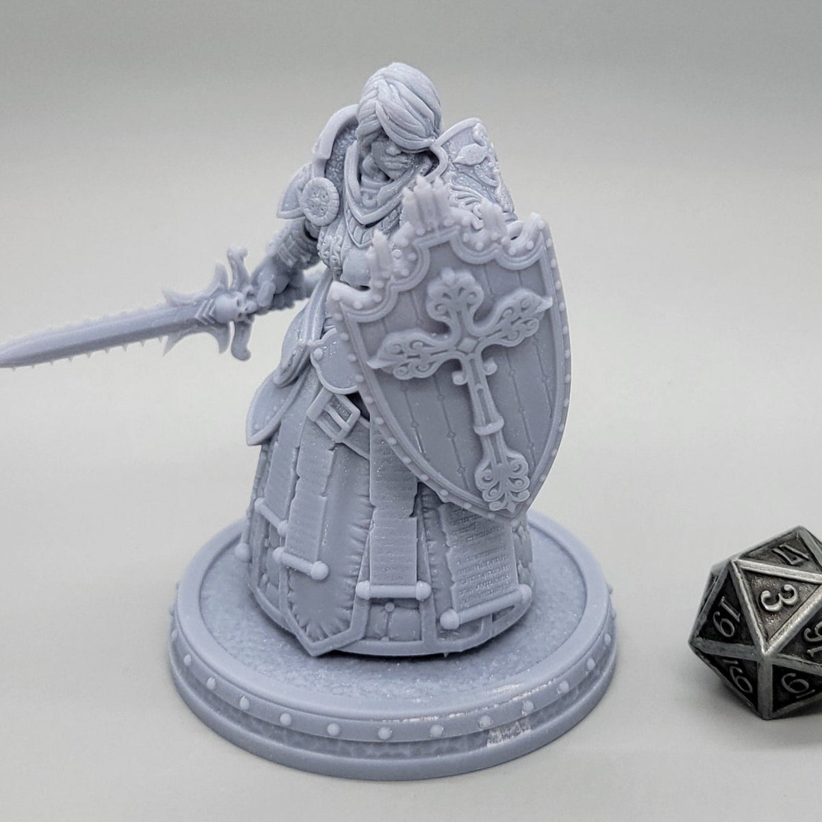 Thyra Malenholt Human Barbarian miniature in heavy armor holding a one-handed sword and large shield.