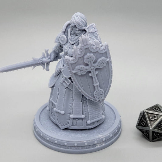 Thyra Malenholt Human Barbarian miniature in heavy armor holding a one-handed sword and large shield.