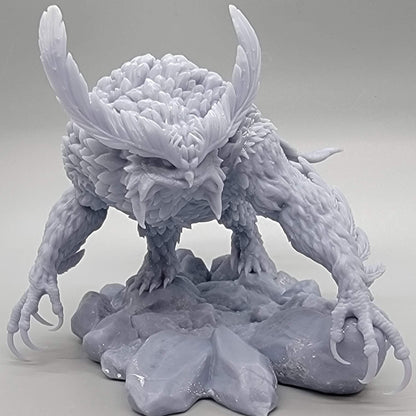 Resin print hero shot of the Titancrest Owlbear miniature by Stormborn Collectibles perched on rocks.