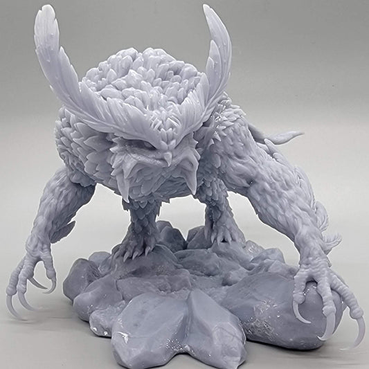 Resin print hero shot of the Titancrest Owlbear miniature by Stormborn Collectibles perched on rocks.