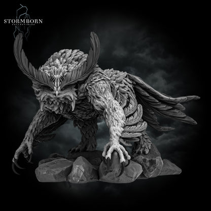 Digital render front view of the Titancrest Owlbear miniature crouched on rocks by Stormborn Collectibles.