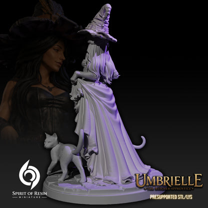 Back view of Umbrielle the Witch Apprentice SFW resin miniature showing flowing cloak, witch hat, and scenic base