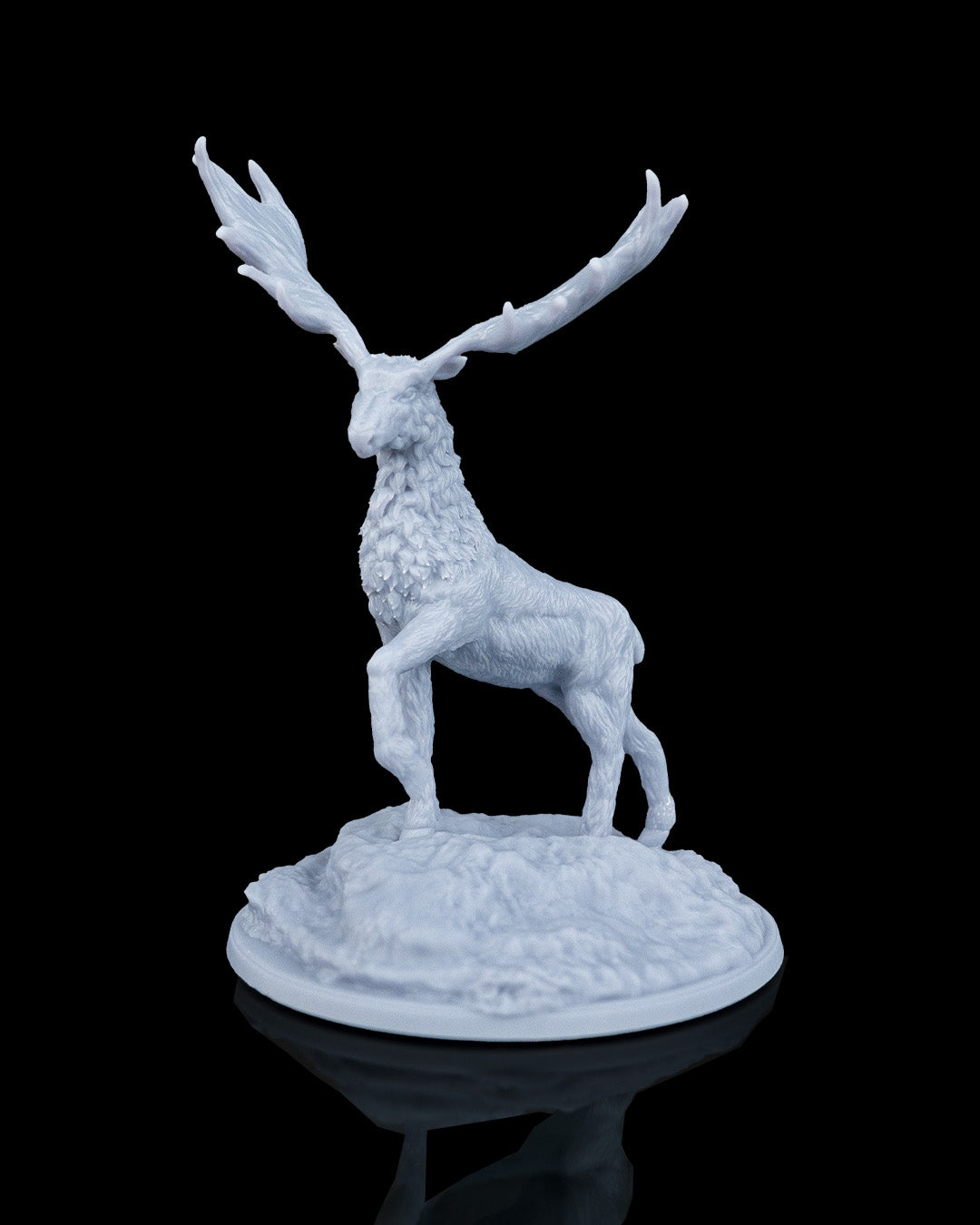 Front three-quarter view of Vaelor the Giant Elk miniature, showcasing massive palmated antlers, a raised front right leg, and detailed neck fur standing on a round rocky hill base.
