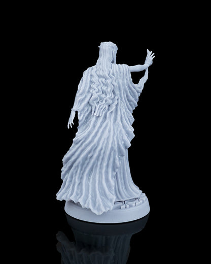 Rear view of the Valyra resin model showing the detailed textures of her long wavy hair cascading down her back and the sweeping movement of her cloak.