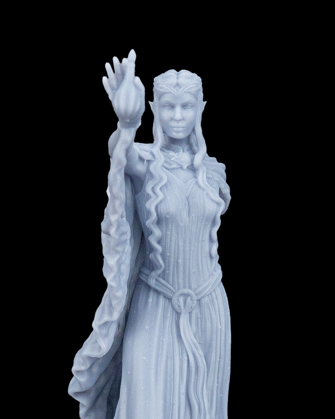 Extreme close-up view of the Valyra resin miniature highlighting the crisp facial details, pointed ears, braided tiara hair crown, and the texture of the magical flame.