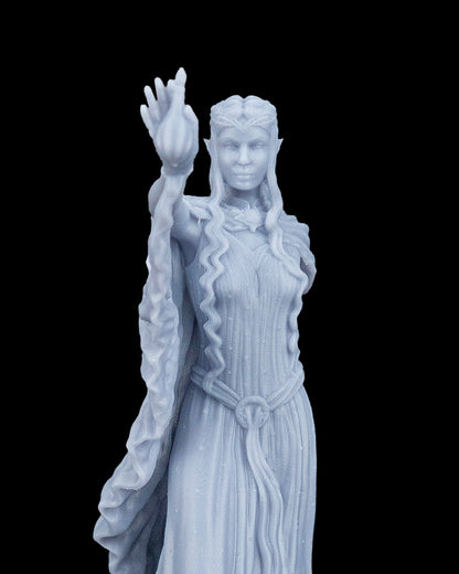 Extreme close-up view of the Valyra resin miniature highlighting the crisp facial details, pointed ears, braided tiara hair crown, and the texture of the magical flame.