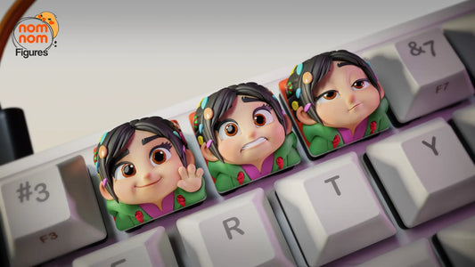 Vanellope keycaps closeup showing three expressions on keyboard