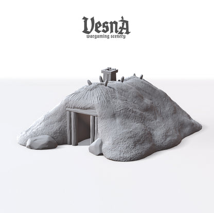 Orthographic front and top-down rendering of the unpainted gray resin Plaggenhut Frisian house terrain piece showing roof ridge detailing and wooden door frame.