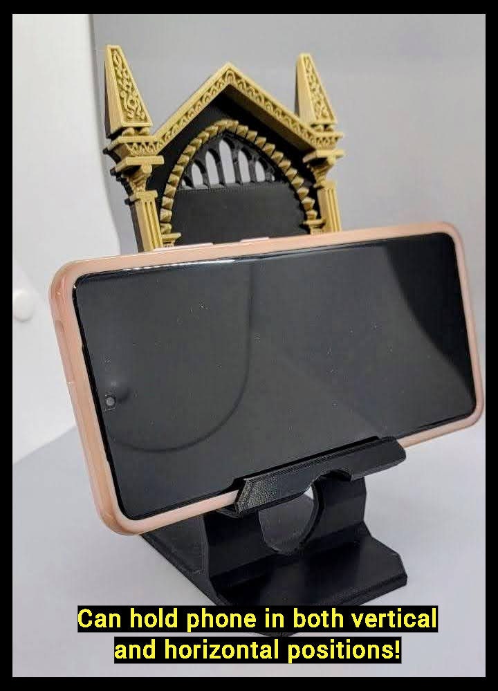 Wizard gothic phone stand holding a smartphone horizontally. Shown with a Samsung S21 Ultra(not included) with a pop socket not show but atttached to phone for size and fit comparison to the phone stand.