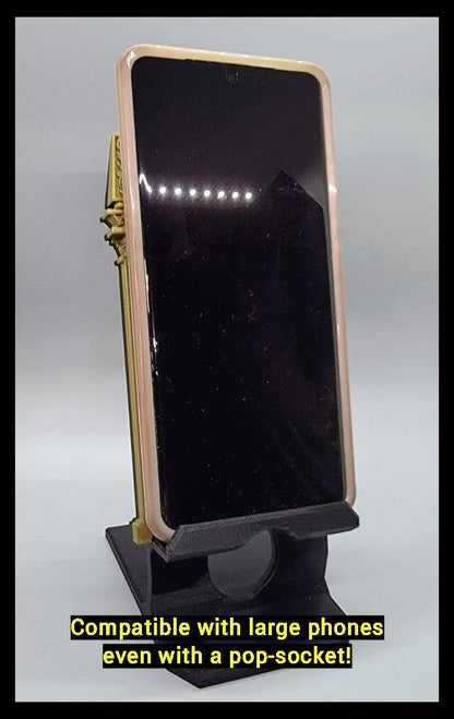 Wizard gothic phone stand holding a large smartphone vertically. Phone is  an S21 Ultra(not included) with a pop socket attached to phone for size and fit comparison to the phone stand.