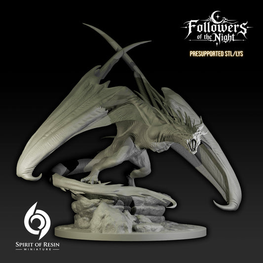 Front view of Zorat Night Terror Dragon resin miniature roaring with wings spread over a rocky base.